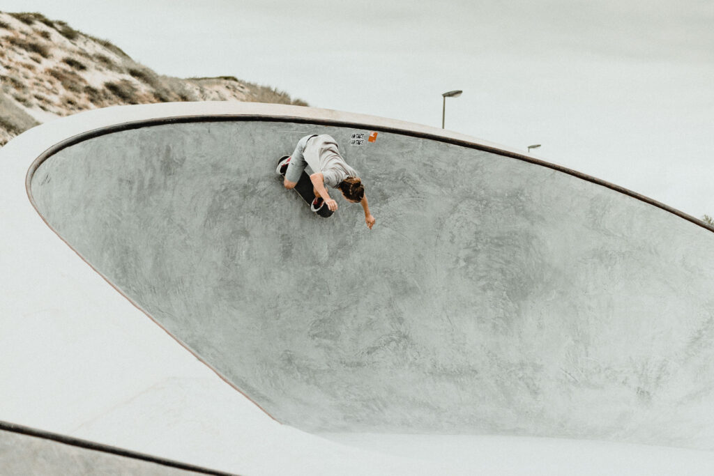 Skateboarder at the new Skatepark next to the dunes of Seignosse Plage by Ondrej Kolacek