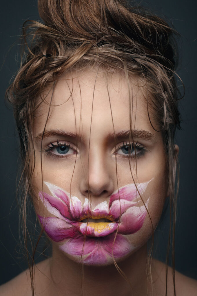 Face covered with a flower painting retouched | MUA Daria Bogatova, MODEL Kate Cherenova, PHOTO Anna Doctor Retouched by Ondrej Kolacek