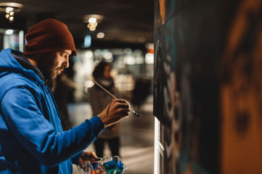 Mindless (Artist) painting a wall