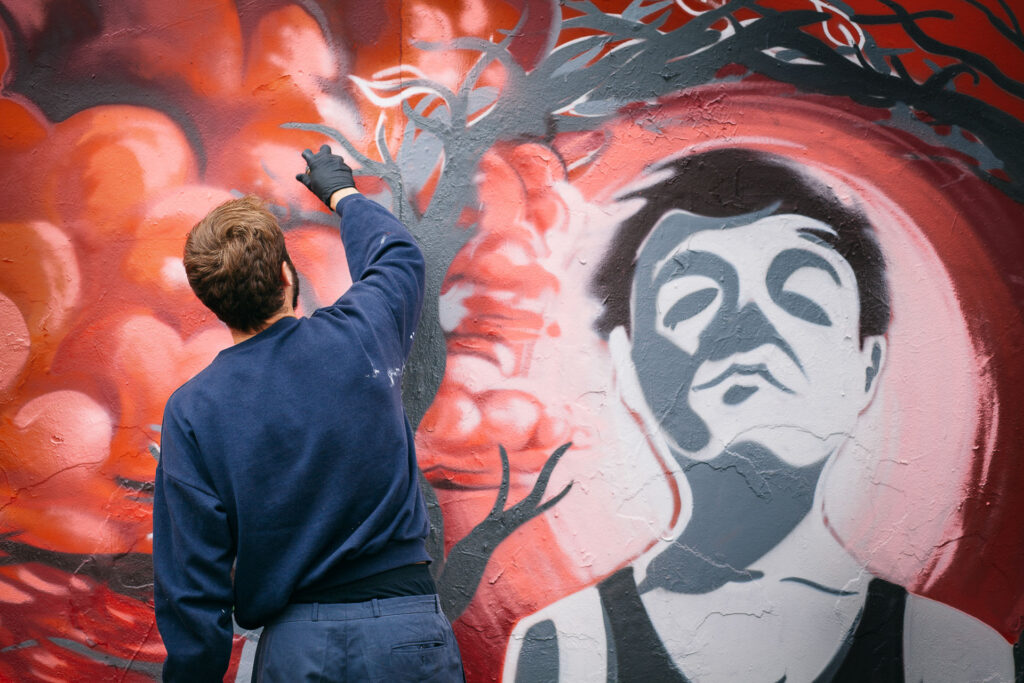 Graffiti Artist spraying a wall