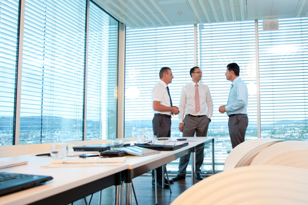 three guys in a office unretouched